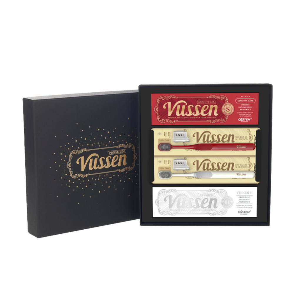 VUSSEN toothpaste set in an open black presentation box with two packaged toothbrushes and a branded lid