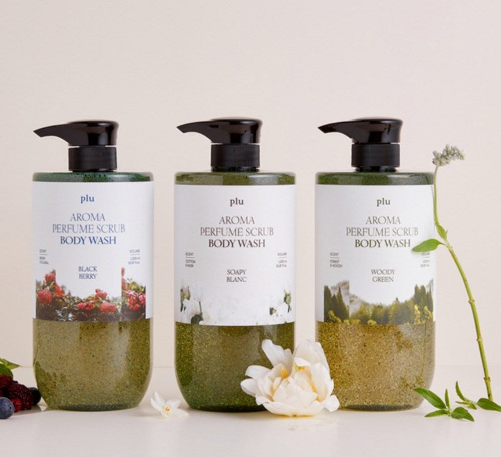 PLU body wash range with Black Berry, Soapy Blanc and Woody Green bottles beside flowers and berries