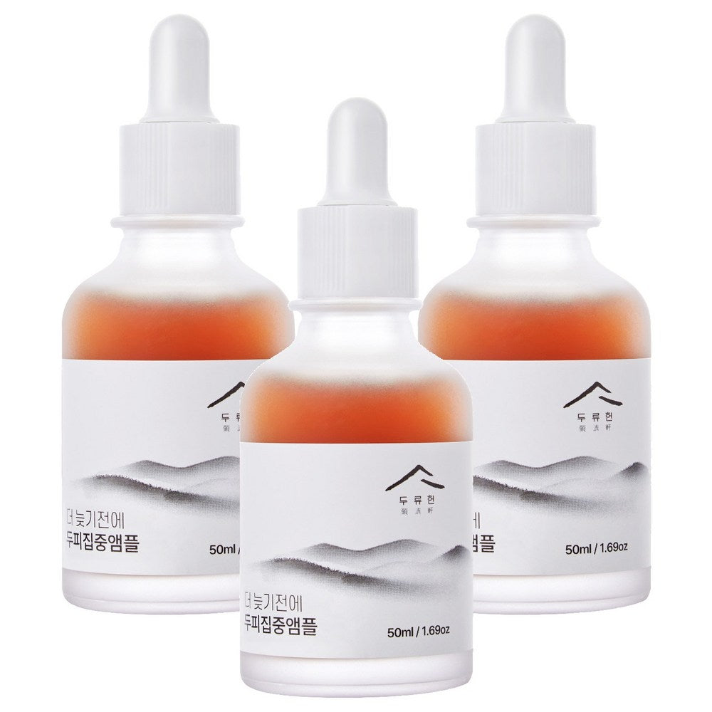 Dooryuheon scalp ampoule set of three bottles with amber liquid, white droppers and grey landscape labels