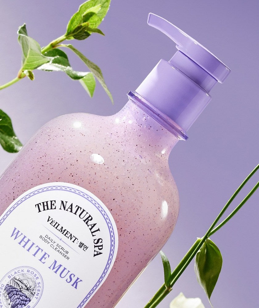 Veilment White Musk body wash close-up at an angle, showing its lavender pump and fine particles inside