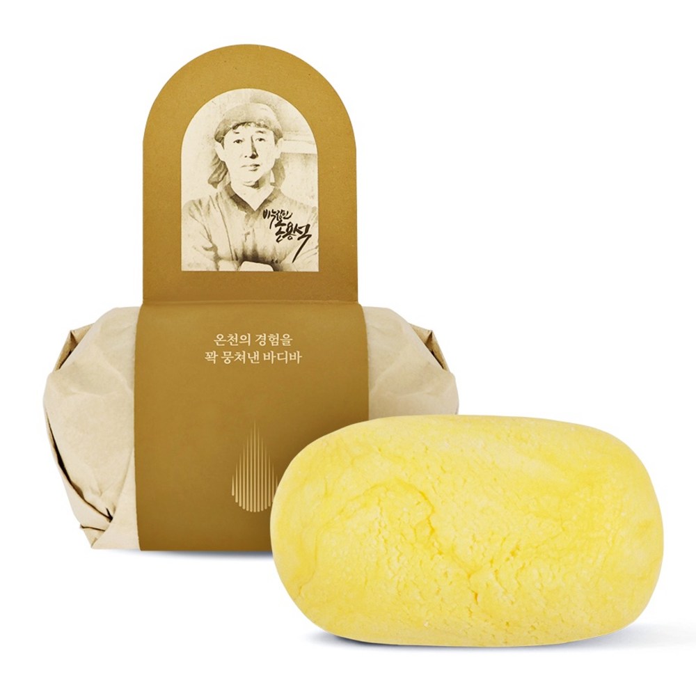 Cheonbinusop sulfur body bar in yellow beside paper wrapping with a gold sleeve and portrait label