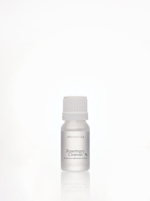 Aromatica Rosemary Cineol essential oil in a frosted bottle with a white ribbed cap, reflected on a white surface