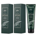 PLU Gentle Forest body scrub in dark green packaging, with two cartons beside a matching squeeze tube
