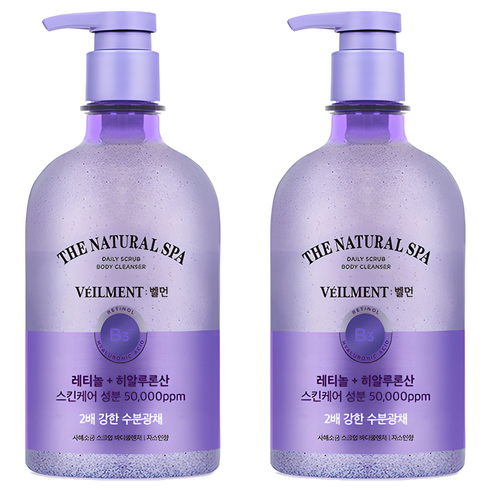 Veilment scrub body wash shown as two purple pump bottles with lavender-coloured labels and black brand lettering