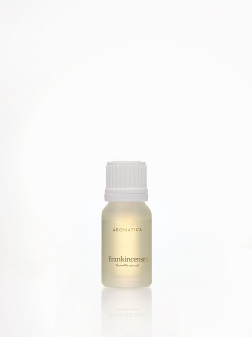 Aromatica Frankincense essential oil in a small frosted bottle with a white screw cap and reflection on white