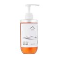 Dooryuheon Scalp Essence Shampoo in a clear 500ml bottle with amber contents, a white pump and mountain label