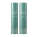 Aromatica Rosemary Salt Scrub Shampoo set with two tall green cylindrical bottles standing side by side