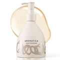 AROMATICA Green Mandarin Hand Soap in a pale patterned pump bottle against a translucent golden cleanser smear.