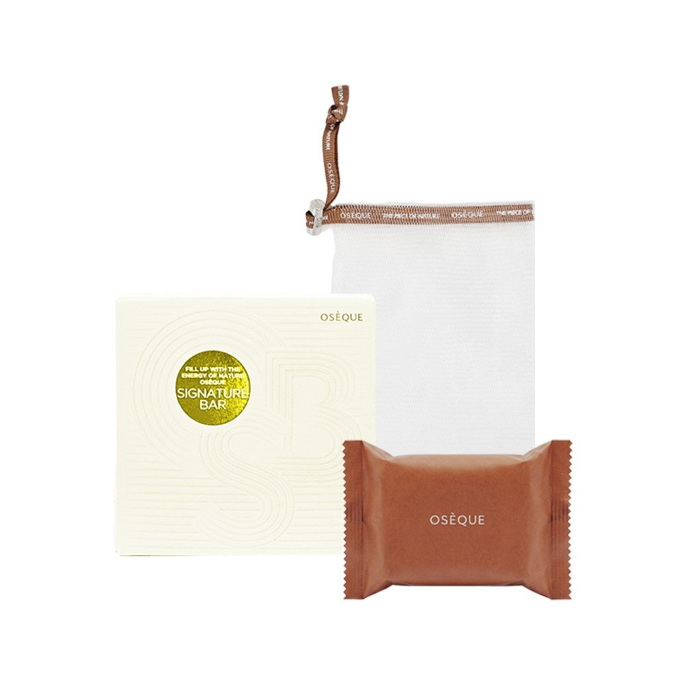 OSEQUE yellow earth soap with one brown wrapper, a pale Signature Bar box and a white hanging foam net