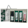PLU Prestige Home Spa Gift Set in an open divided box with a pump wash, two green scrubs, peeling gel and gift bag