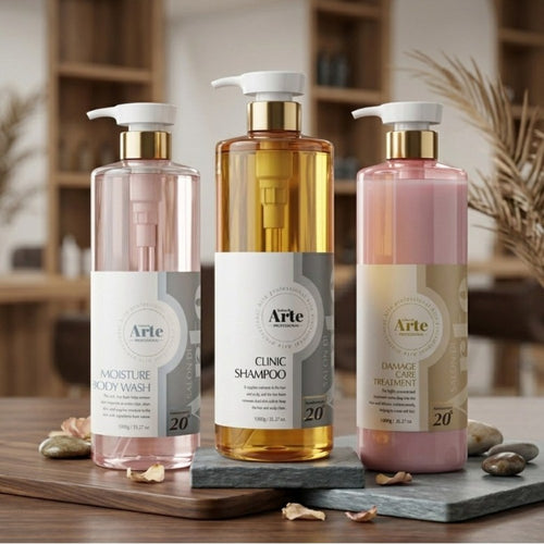 ARTE shampoo and body wash set with three white pump bottles in clear pink, amber and opaque pink on wood and stone