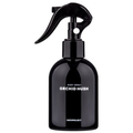 Bath Project Orchid Hush body spray in a glossy black trigger bottle with white scent and brand lettering