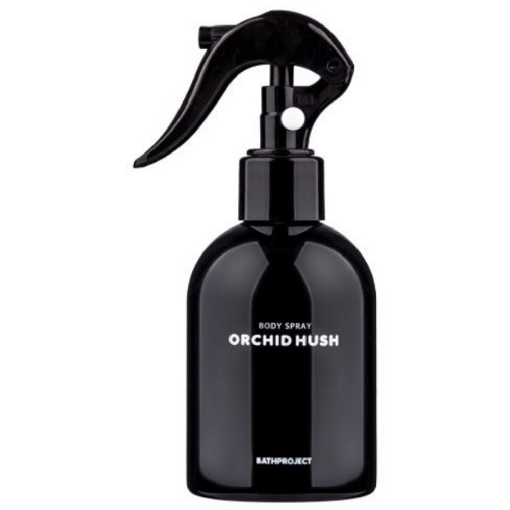 Bath Project Orchid Hush body spray in a glossy black trigger bottle with white scent and brand lettering