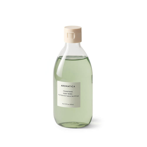 Aromatica Awakening body wash shown upright against white, with a cream label, pale green liquid and capped top