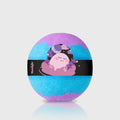 Labsbalm Moonlight bubble bath bomb in turquoise and purple with a black illustrated band on a pale background