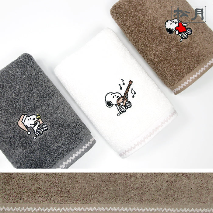 Songwol Snoopy solid face towels in gray, ivory and brown with different character motifs and pale zigzag borders