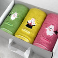 Songwol rabbit face towel set in an open gift box with green, yellow and pink towels and magician embroidery