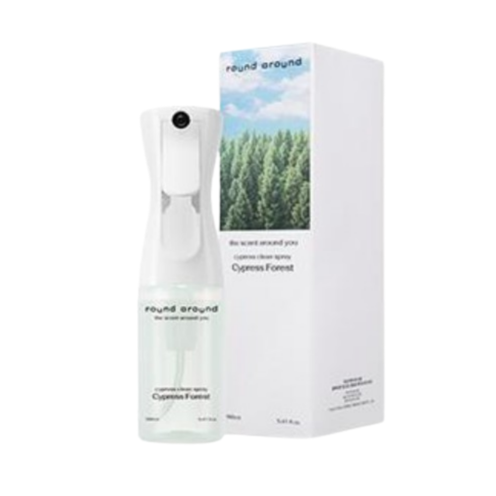 Round Around Hinoki Clean Spray in a pale green bottle beside a white box with a Cypress Forest photograph
