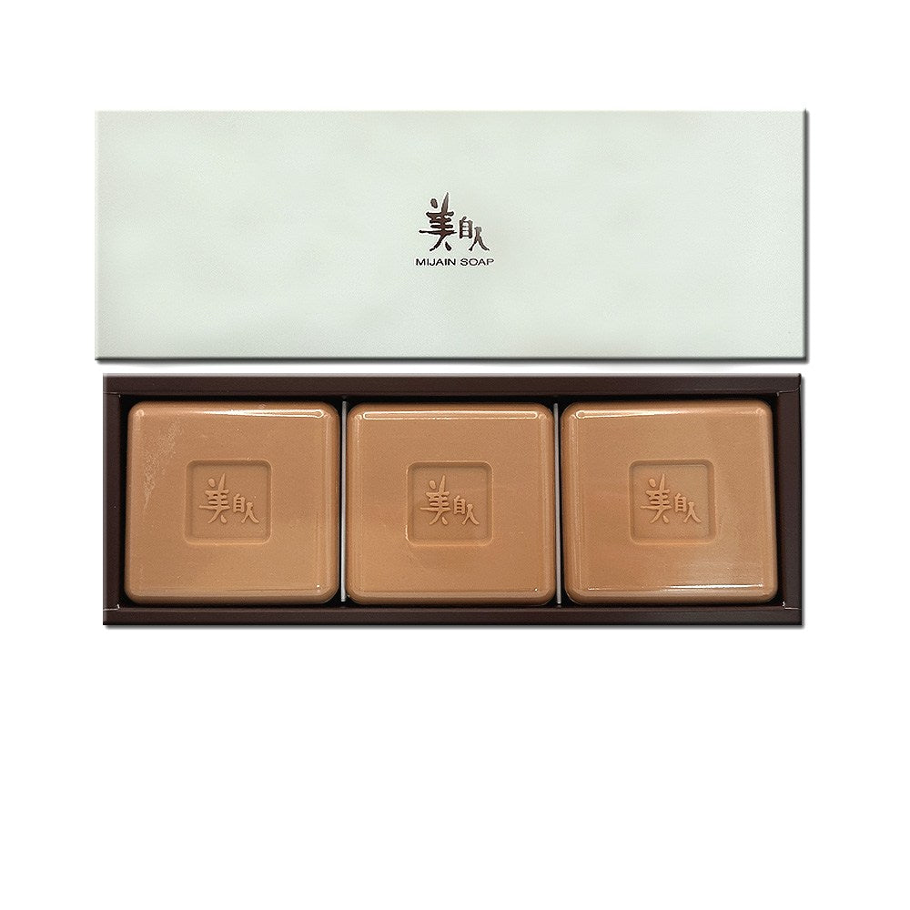 Mijain yellow clay soap displayed as three square brown bars in an open rectangular box with a pale lid above