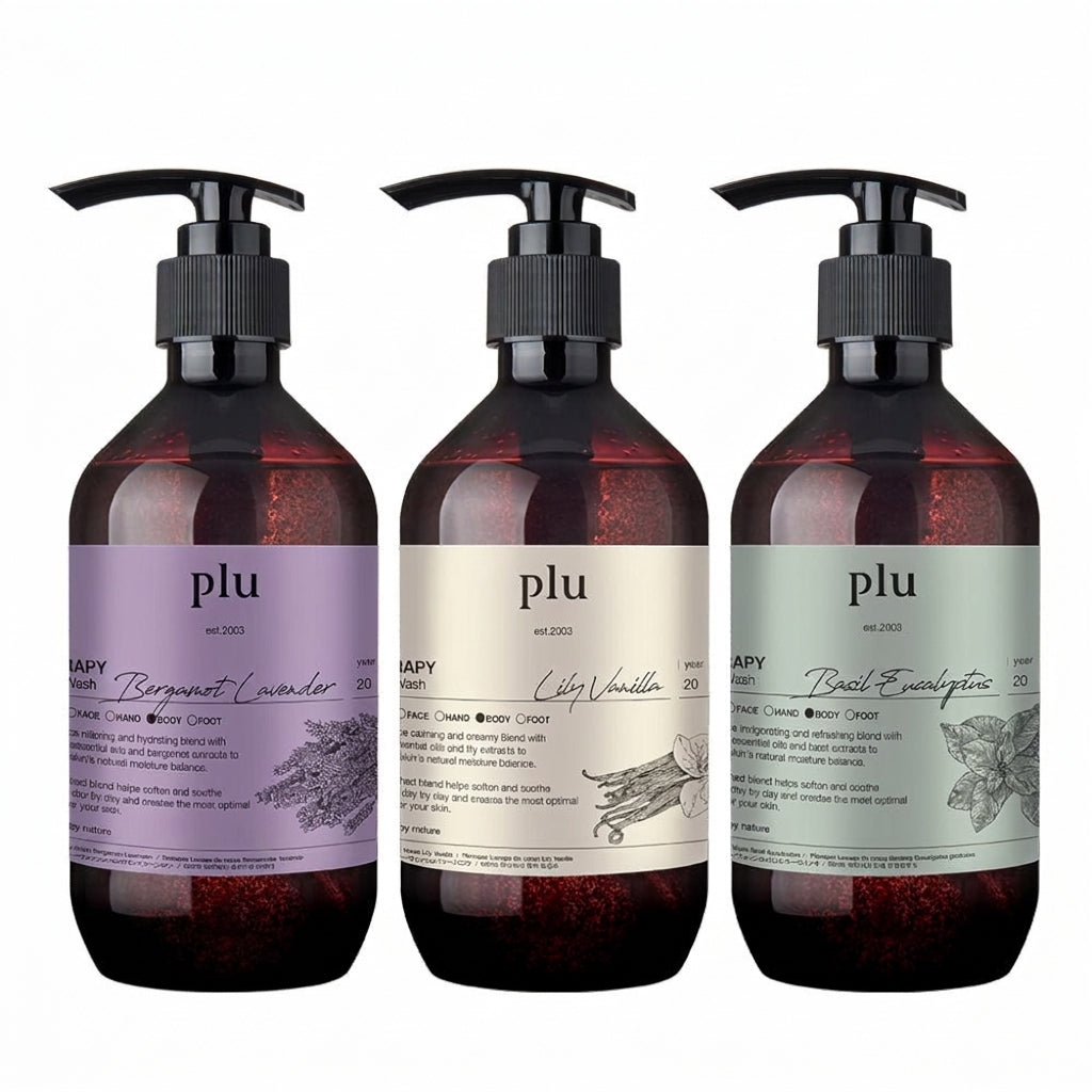 PLU Therapy body wash in three dark pump bottles with lavender, cream and pale green scent labels