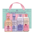 Veilment Spa body care gift set with four peach and lavender cleanser bottles and a mint box with pink handles