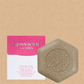 Kim Seok-ho Flower soap bar with a flecked six-sided surface beside its pink-and-white ccotbi box