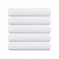 Songwol plain cotton towels in white, shown as a stack of five folded towels with subtle borders at the right