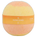 Labsbalm Sun-kissed bath bomb with peach and yellow layers and an orange Sunkissed band against white
