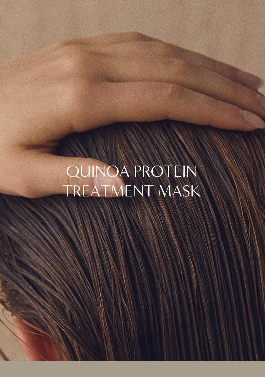 Aromatica Quinoa Protein Treatment Mask promotional photo showing a hand resting on smooth brown hair